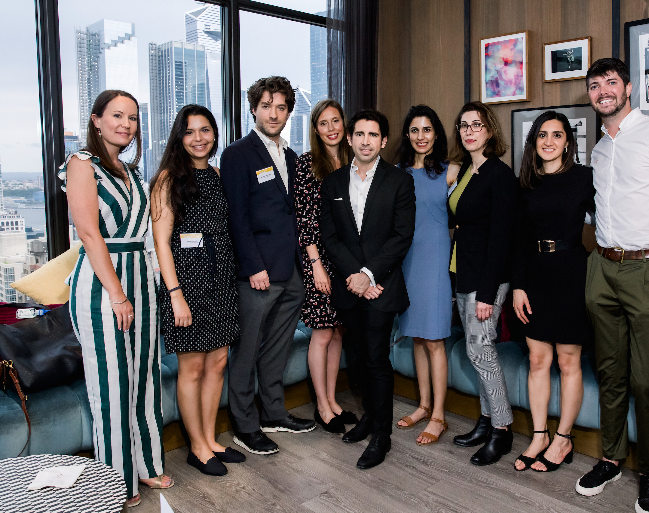 Nine attendees of the UCL New York Alumni chapter, including US-based alumna Ritika Gupta (second from right).