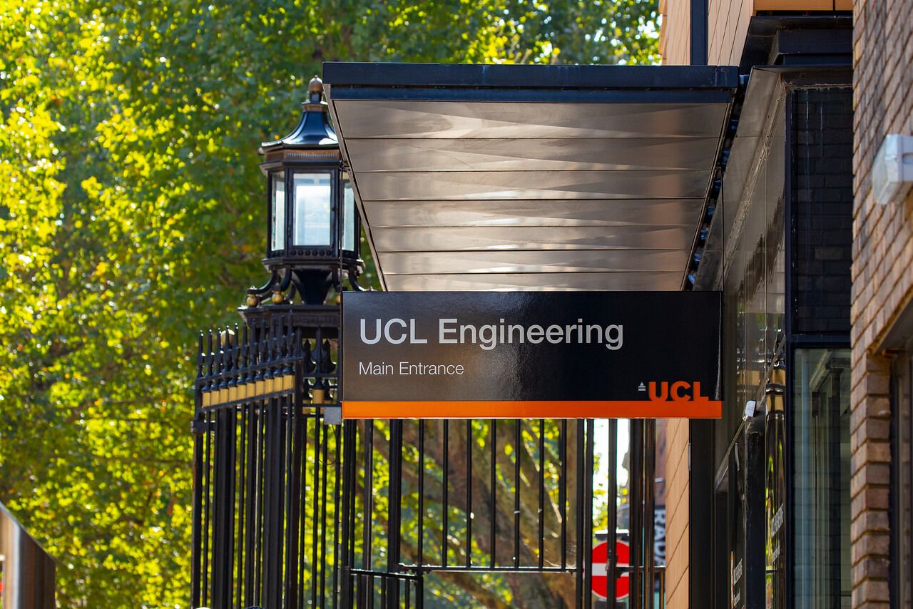 Entrance signage to the UCL Engineering Building at Malet Place, Bloomsbury, with green trees in the background.